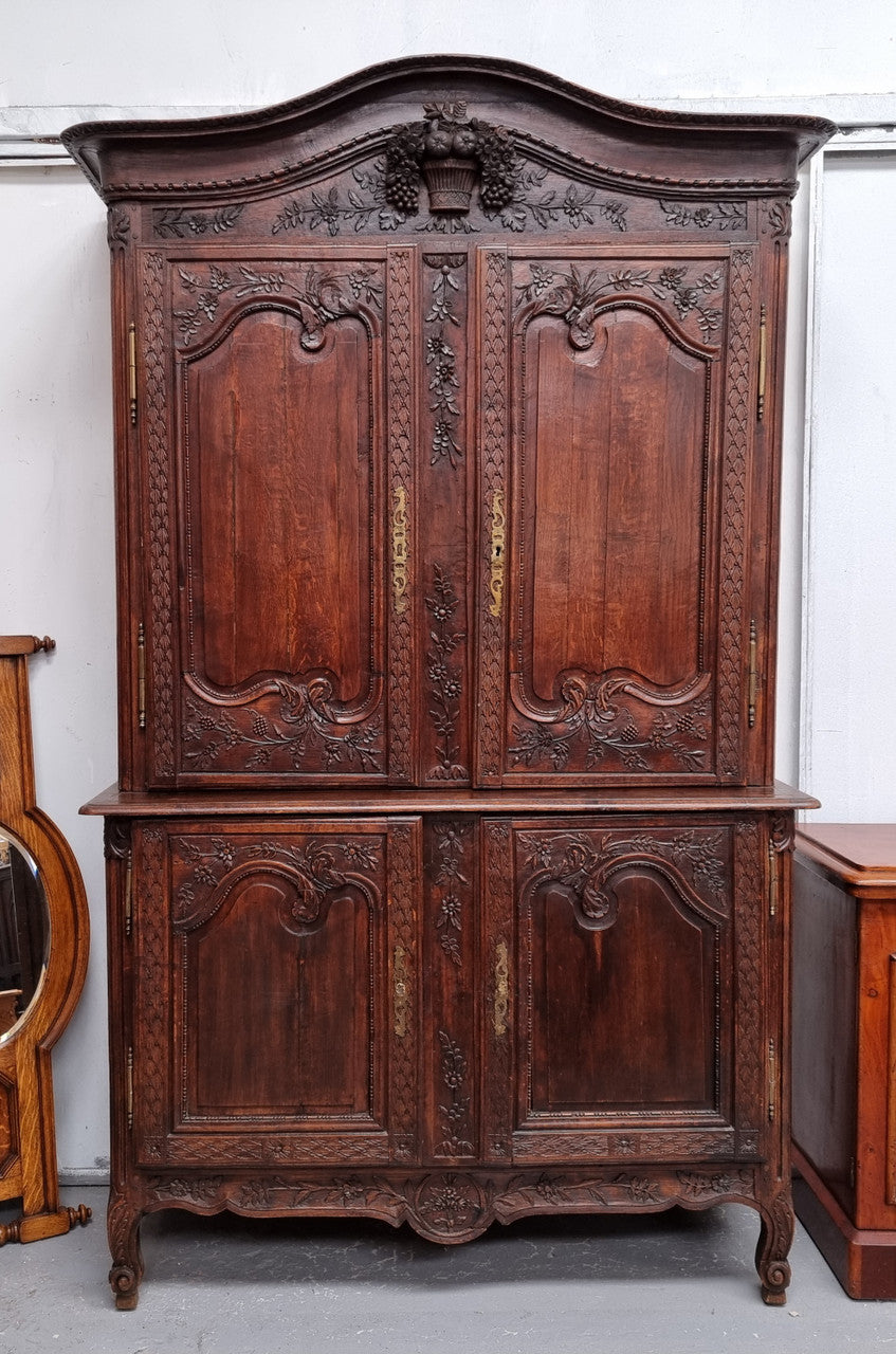 French Oak 18th Century superbly carved sideboard buffet. This amazing buffet has loads of character which is expected being circa 1790's. The top section has two fixed shelves and the bottom section has one fixed shelf. It has been sourced from France and is in good original detailed condition.