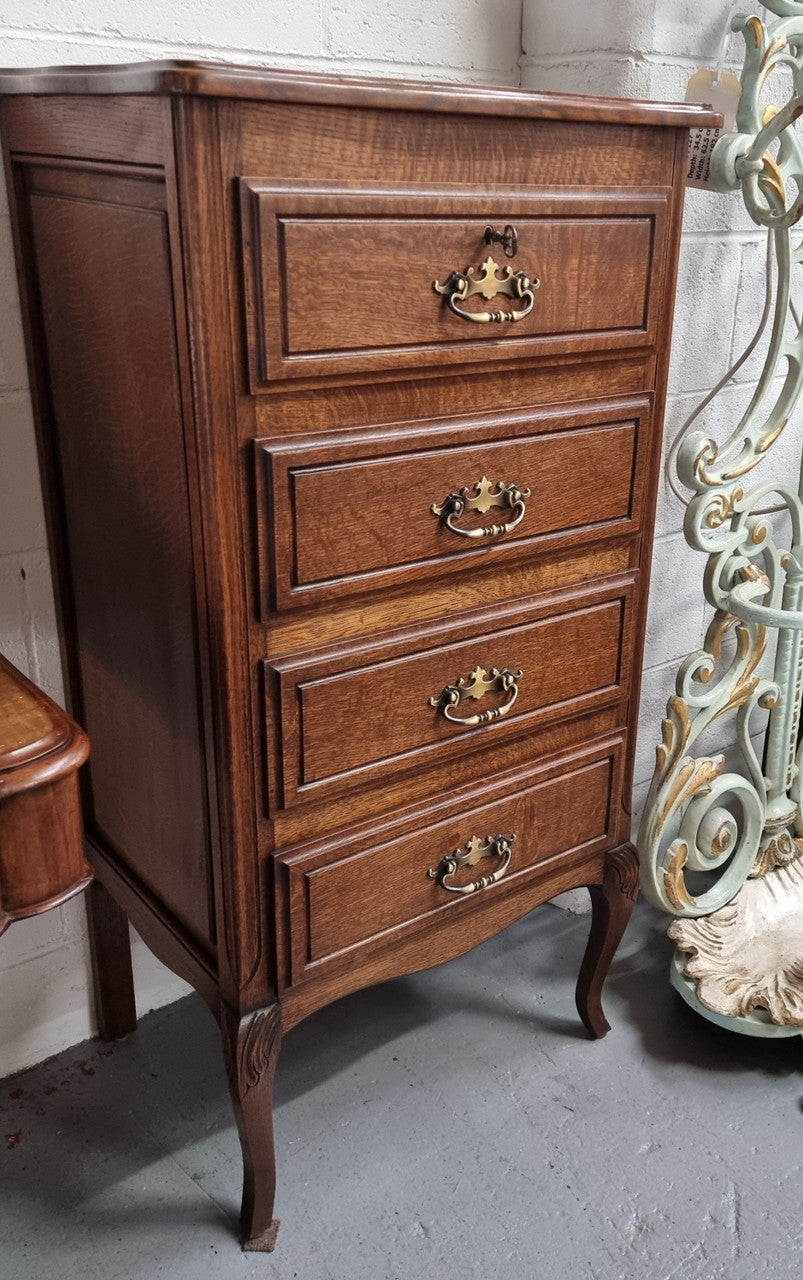 Elegant French Oak Louis XV style four drawer chest of drawers. It has lovely carvings and it is in good original detailed condition. It has been sourced from France.