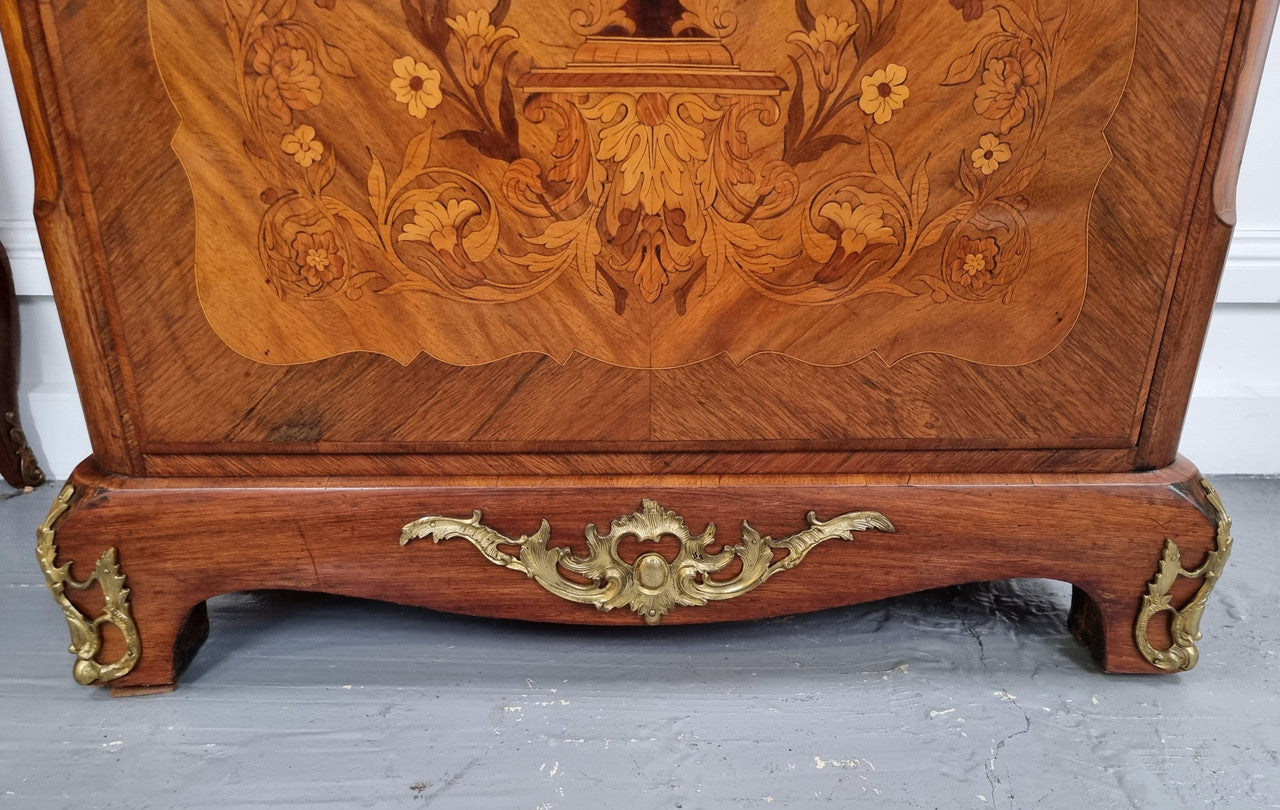 Elegant French transitional style Walnut & Kingwood Salon cabinet. It has beautiful marquetry inlay, a marble top and decorative ormolu mounts. Sourced From France and is in good original detailed condition.