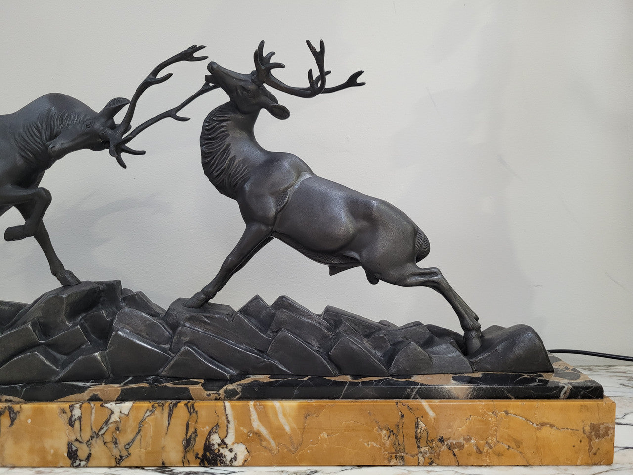 French Art Deco bronzed spelter and marble"Fighting Stags" statue by renowned artist and sculptor "Irenee Rochard".