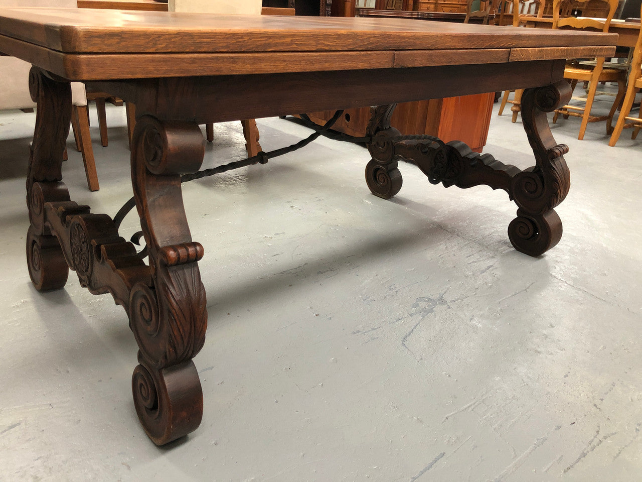 French Oak Renaissance style extension table with a lovely parquetry top and decorative carved and iron base in good original detailed condition.