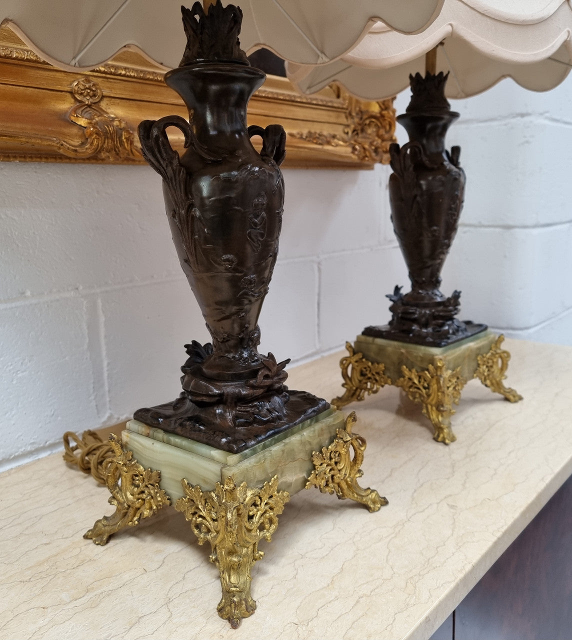 Pair of decorative Antique French gilt bronzed metal and marble table lamps. In good original detailed working condition.