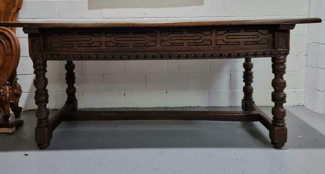 Rare and Charming 17th Century Spanish Walnut serving / side table. It has an incredible one piece walnut top with amazing character and colour. The base displays the original patina aswell as three drawers with carving and remnants of original locks. Superbly turned legs terminating on a stretcher base. Could be used as a large entrance console table, a side table or in a dining area as a serving table. In good original detailed condition especially considering its age.