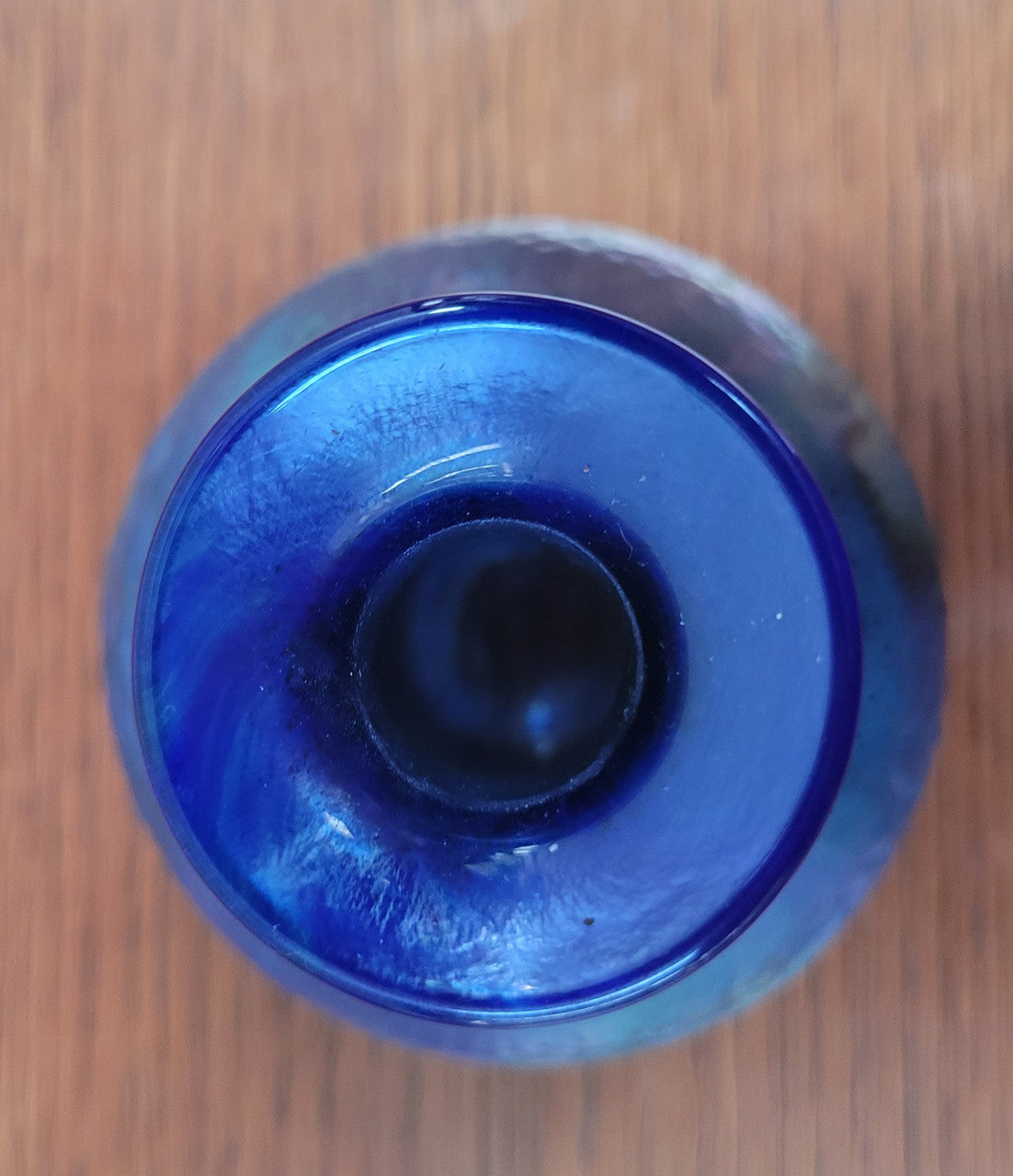 Stunning iridescent hand blown perfume bottle. Beautiful peacock blue, purple colours. Signed on base with clear glass stopper.
