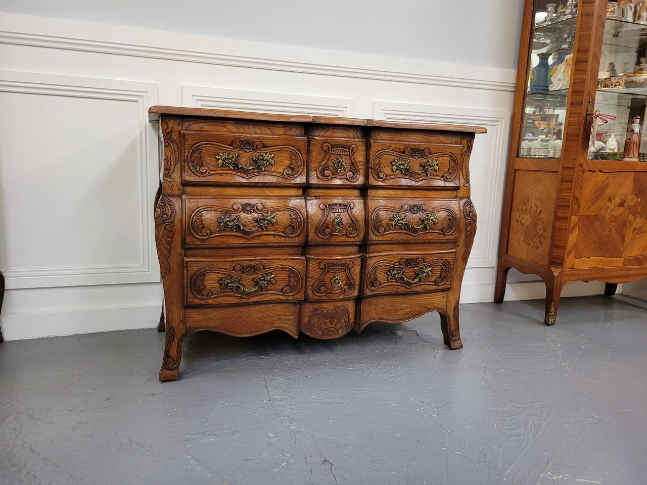 French Antique Louis XIV style Oak wooden top commode. It has a stunning serpentine bombe shape front along with amazing handles and carvings. It comes with three beautiful keys as pictured and comes with working locks. It has been sourced from France and in good original detailed condition.