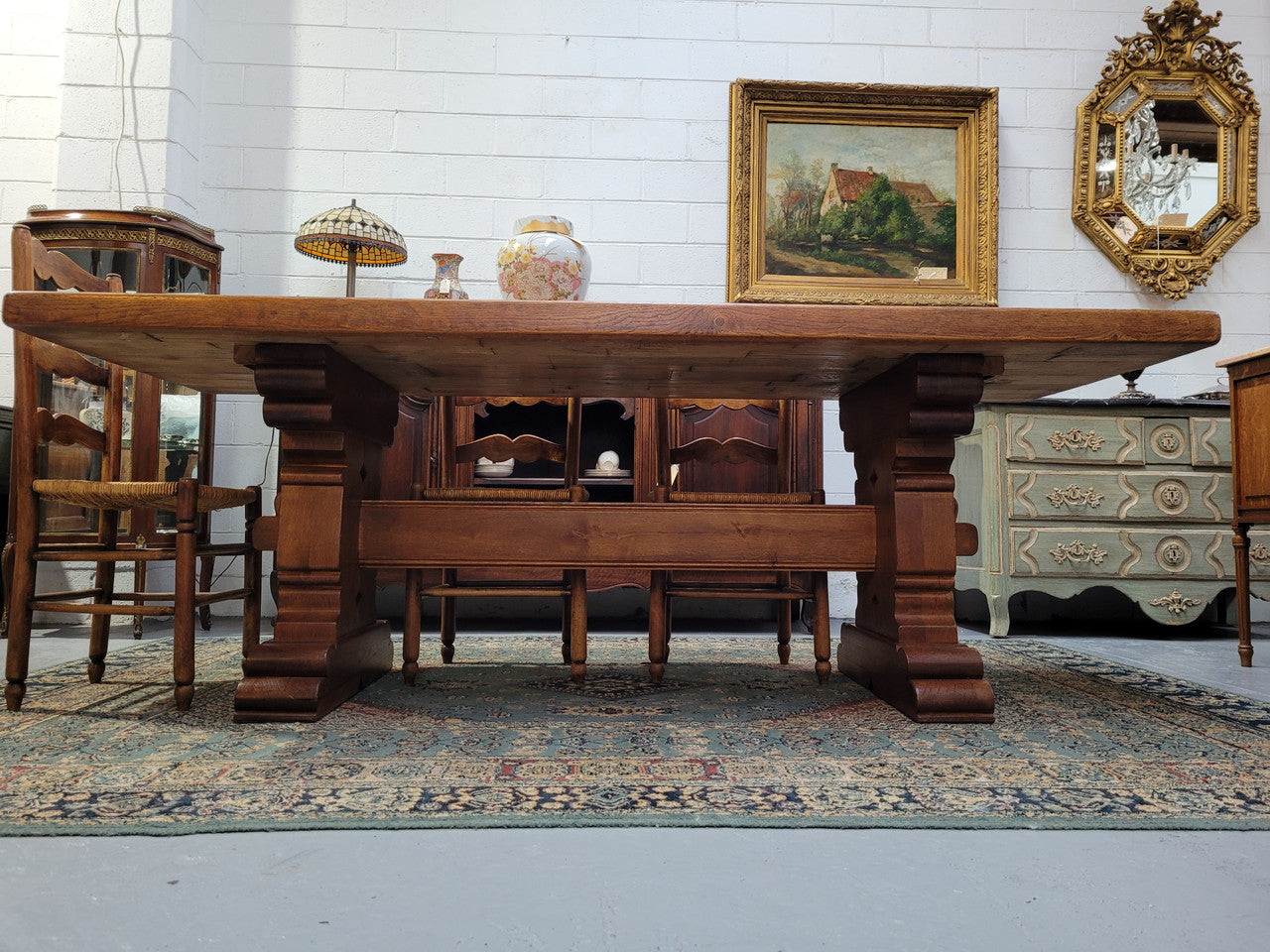 French Farmhouse table with a beautiful thick plank top and stretcher base. Can seat 8-10 people comfortably and is in good original detailed condition.
