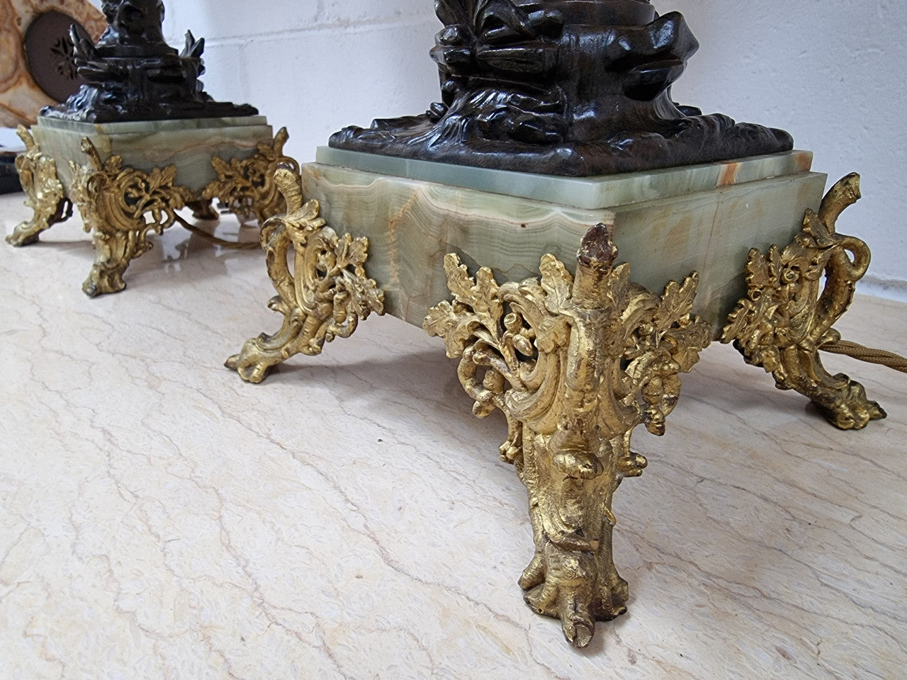Pair of decorative Antique French gilt bronzed metal and marble table lamps. In good original detailed working condition.