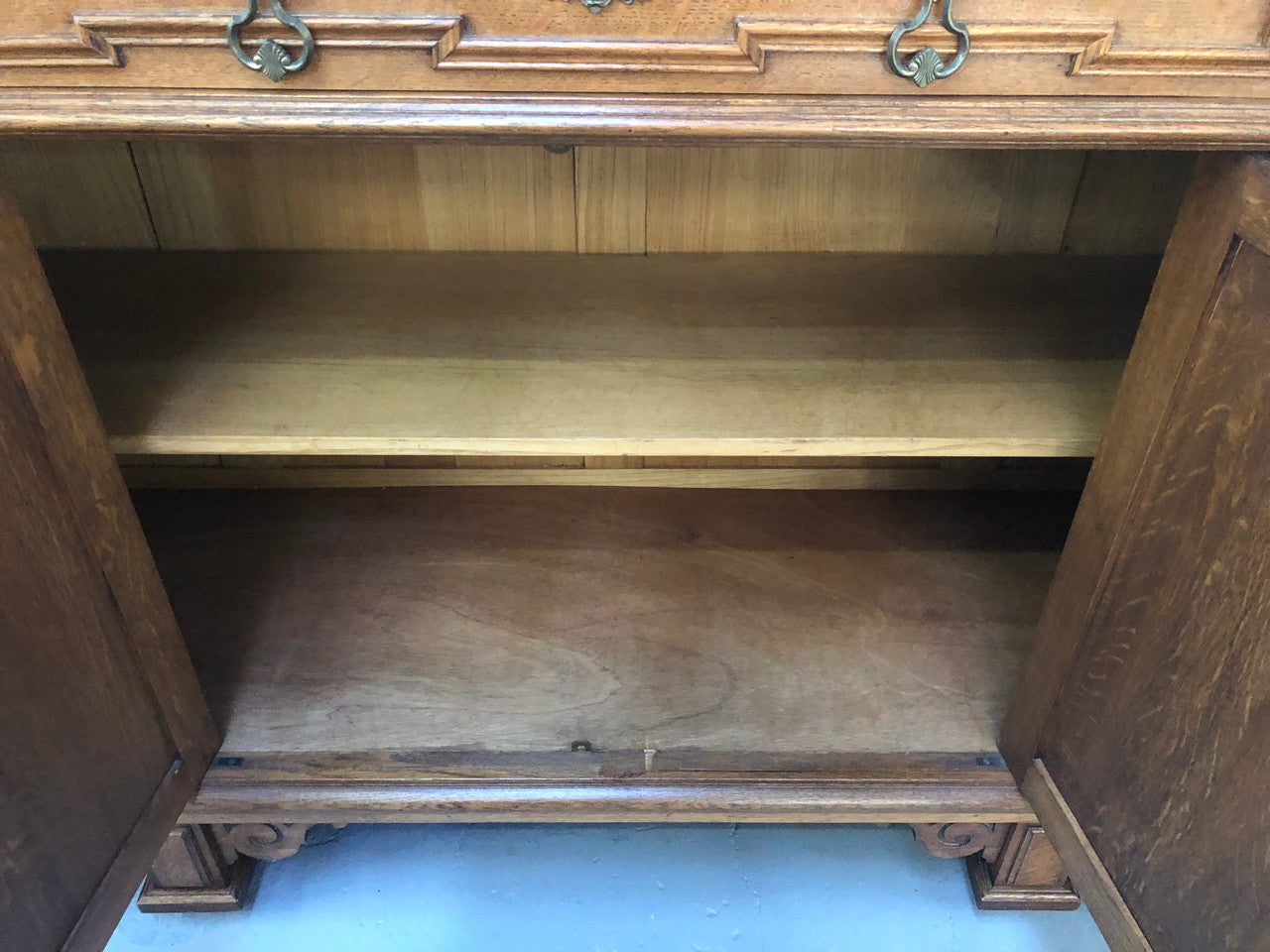 Beautiful carved French Oak four-door buffet with three drawers and lots of room for storage in good original detailed condition.
