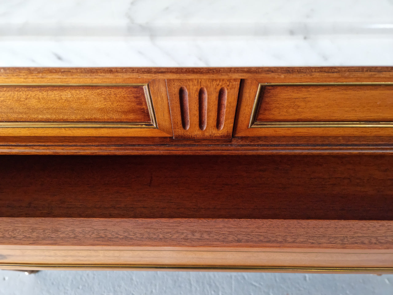 Beautiful French Louis XV Style Marble top five drawer commode. There are five drawers and it has a lovely brass inlay. It is in good original detailed condition.