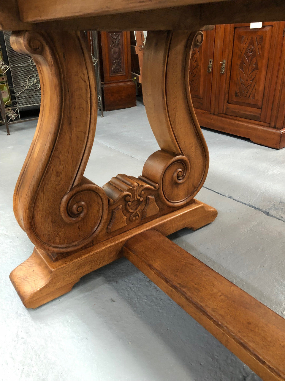 French oak fixed farmhouse table with a charming harp-shaped base. In good original condition and can seat 6-8 people. Circa 1930.