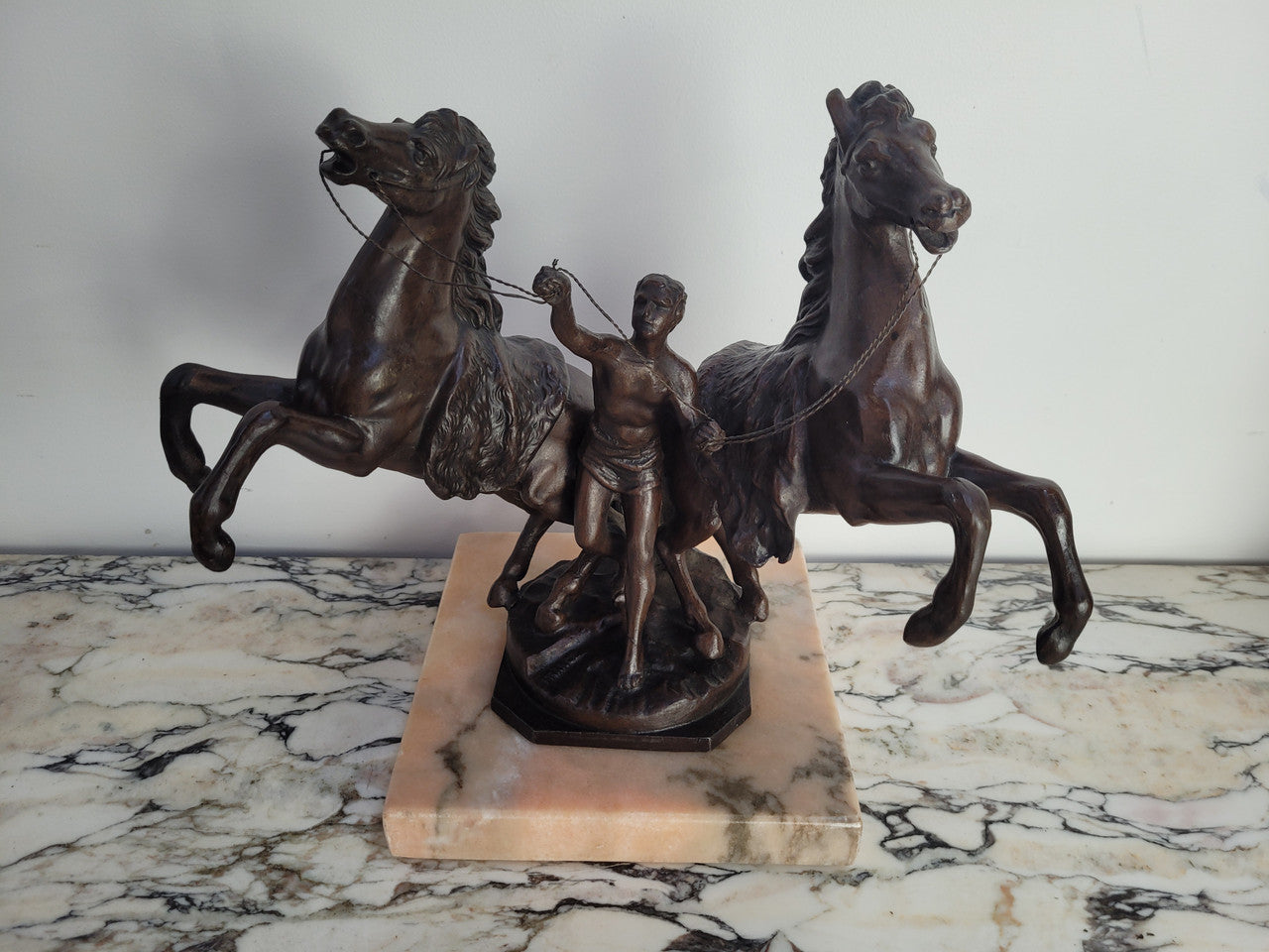 French Art Deco cold painted bronze metal marley horses style statue on a marble base. It is in good condition.