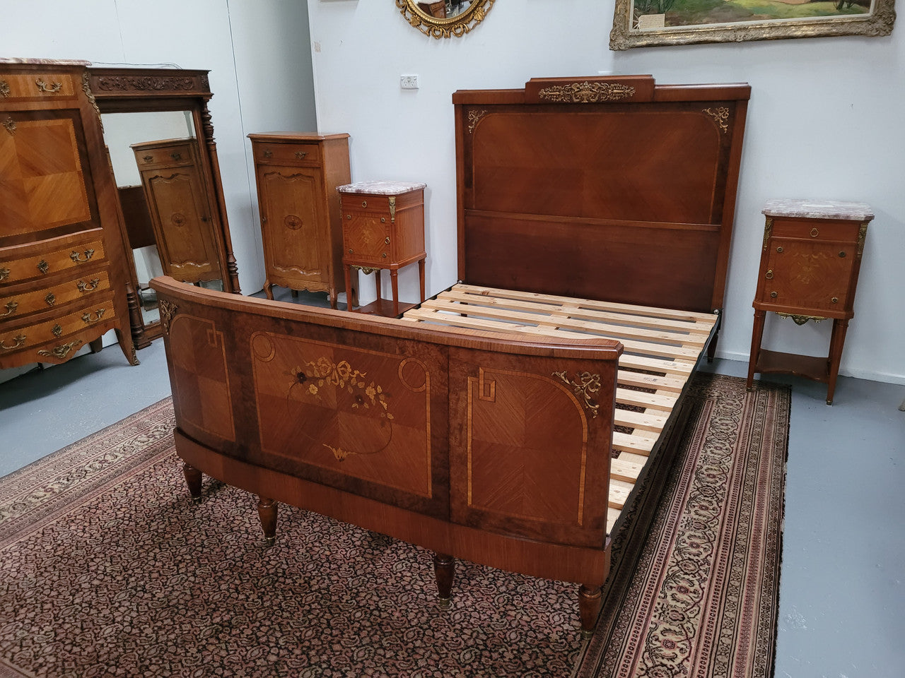 A high quality French Louis XV style bow fronted Queen size bed with marquetry inlay and ormolu mounts. In good original detailed condition. Circa: 1920
