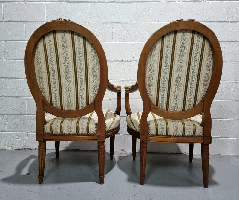 Pair of French Louis XV matching carved armchairs. They are in good overall condition with some slight wear to fabric, please view photos as they help form part of the description.