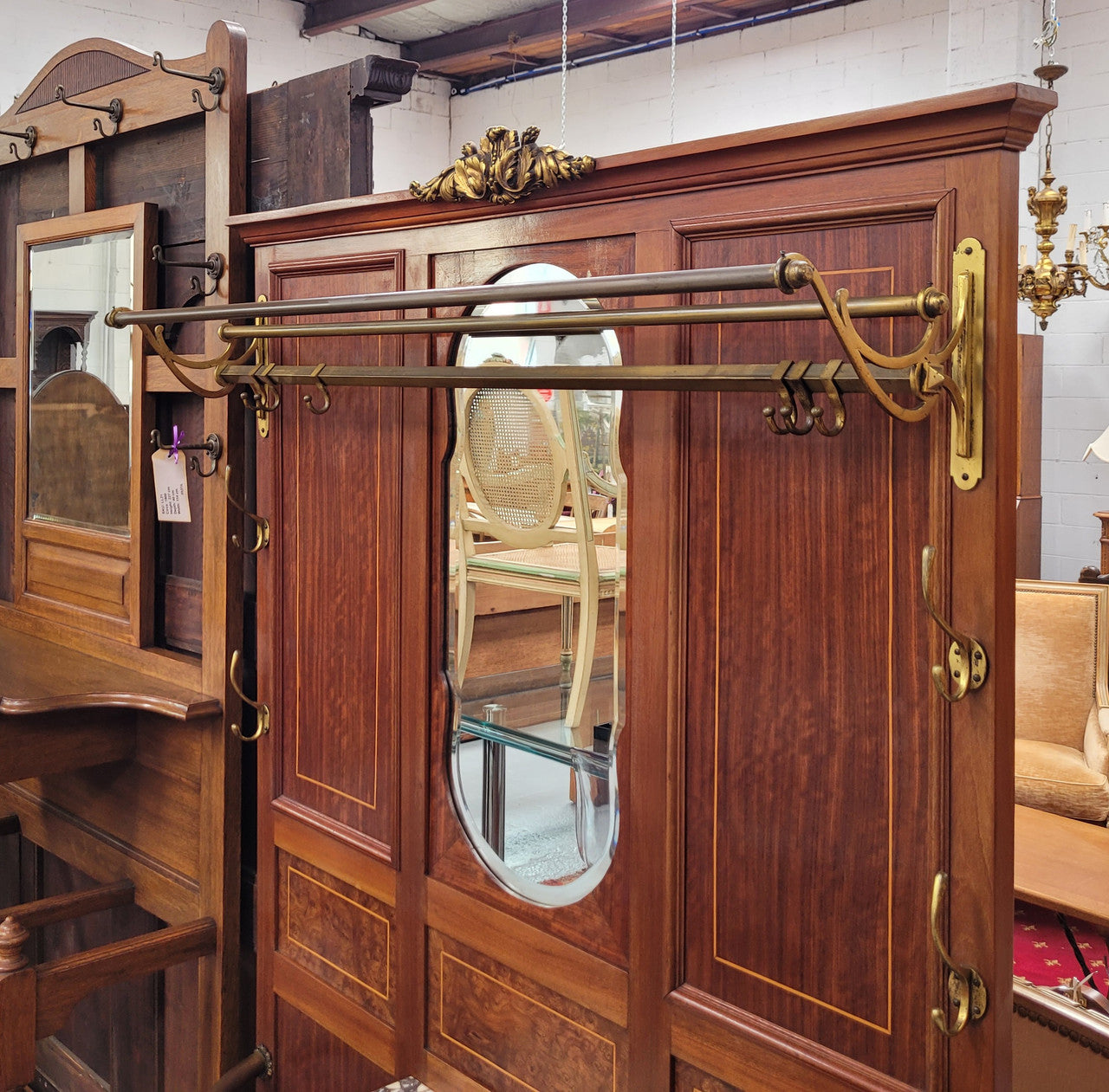 Attractive French Burr Walnut Hallstand. It has a single drawer, cupboard, brass rods, umbrella storage and a marble shelf. It is in good original condition. Please see photos as they form part of the description.