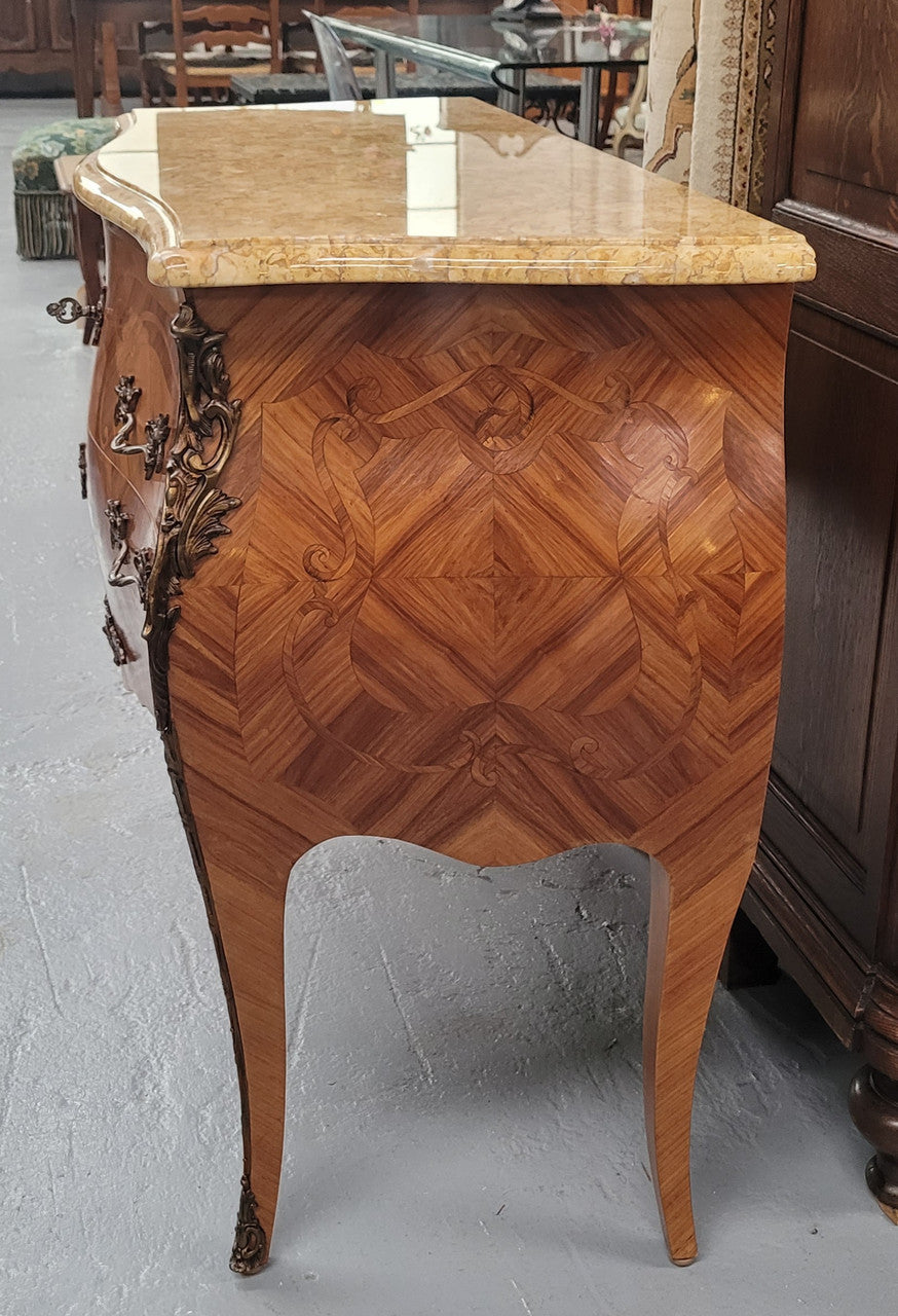 An elegant French Louis XV style kingwood two drawer commode with beautiful decorative inlay and ormolu mounts. Stunning coloured marble top and is in good original detailed condition.