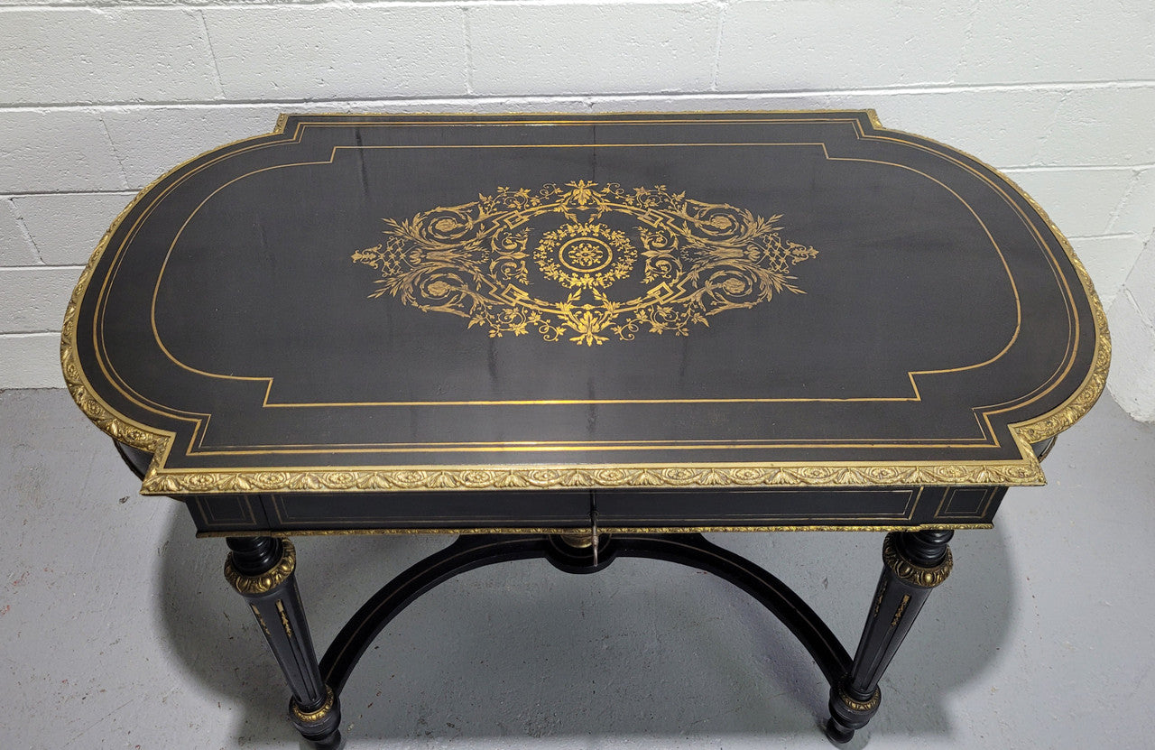 19th Century Napoleon III boulle ebonized centre table. Beautiful decorative mounts and has a drawer on one side. In good restored condition.