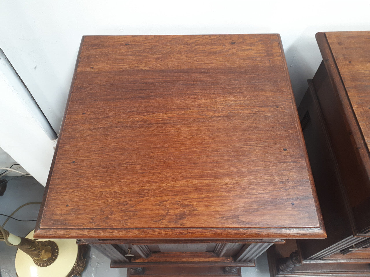 A hard to find pair of French Oak wooden top bedside cabinets. In good original condition. Circa 1920.