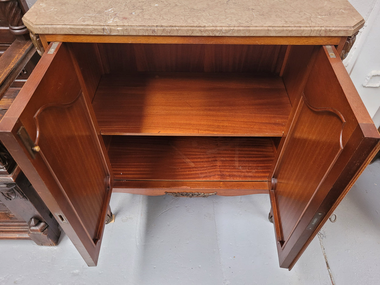 Stunning compact Louis 15th style two door walnut cabinet with ormolu trim and marble top. It is in good original condition.