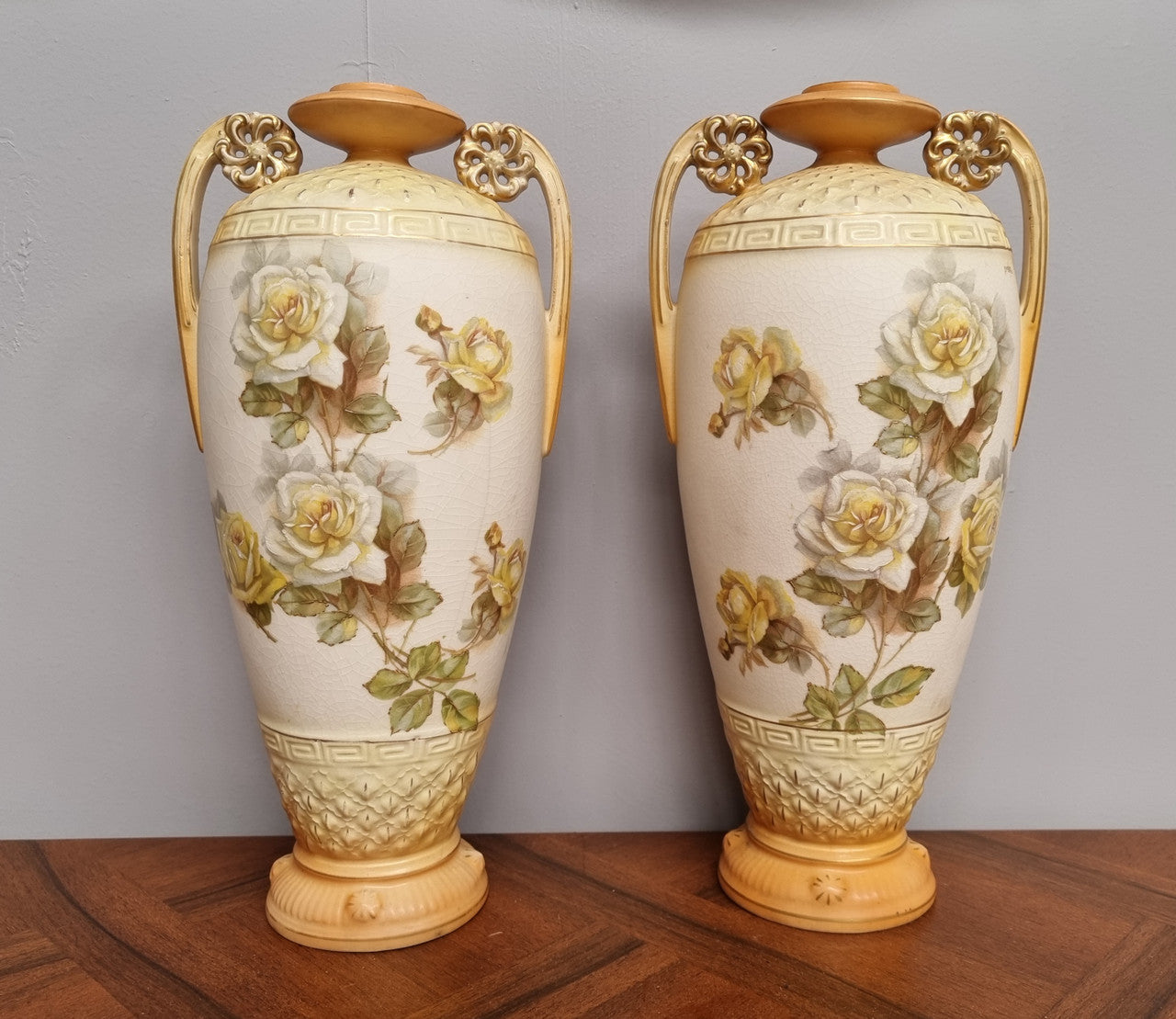Lovely pair of Edwardian floral vases from Austria with beautiful roses on them in good original condition. Some crazing throughout please view photos as they help form past of the description.