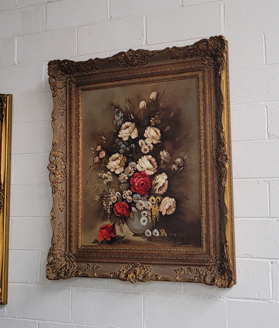 Attractive French floral oil on canvas - signed. Mounted in a stunning patterned gilded frame. It is in good original detailed condition.
