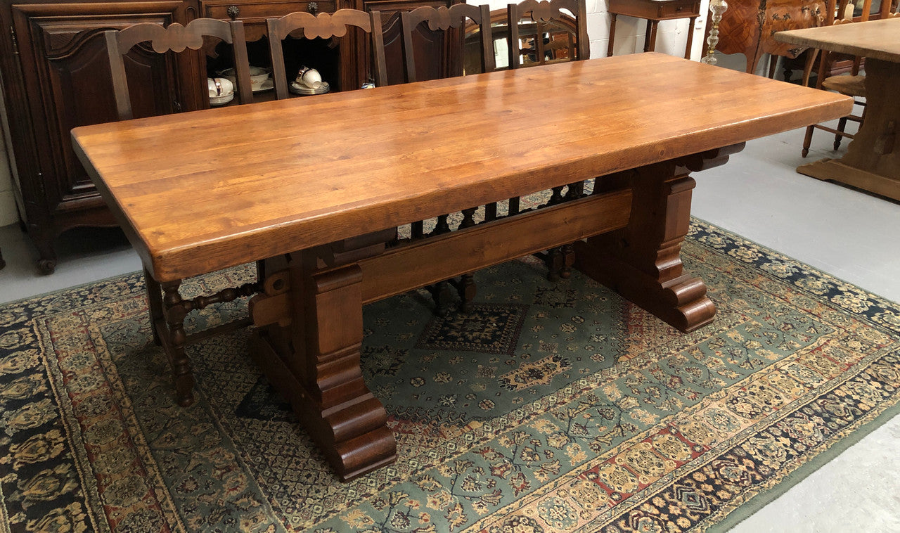 French Farmhouse table with a beautiful thick plank top and stretcher base. Can seat 8-10 people comfortably and is in good original detailed condition.