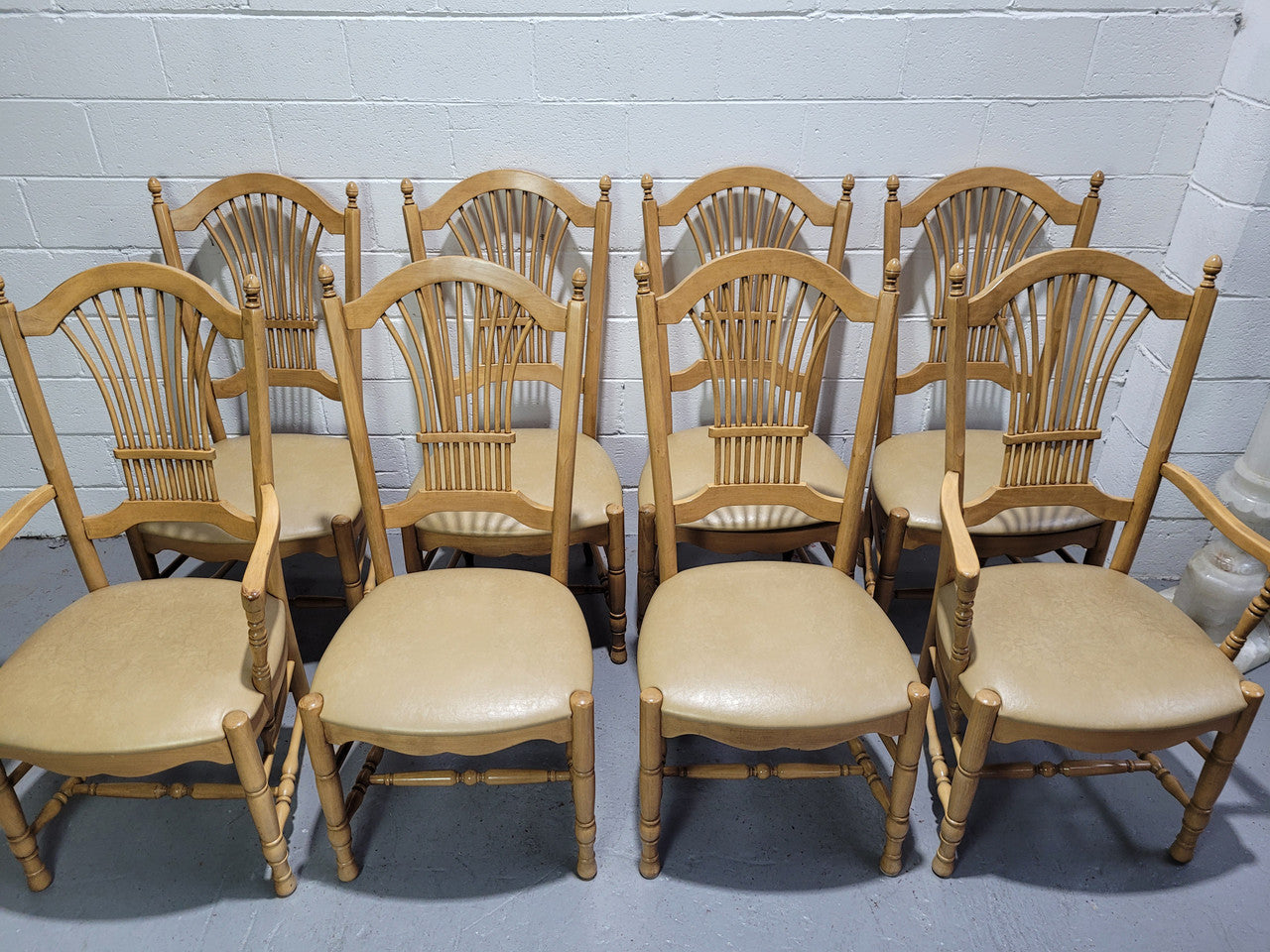 French country style set of six dining chairs and two carvers with leather seats. They are all in good original detailed condition.