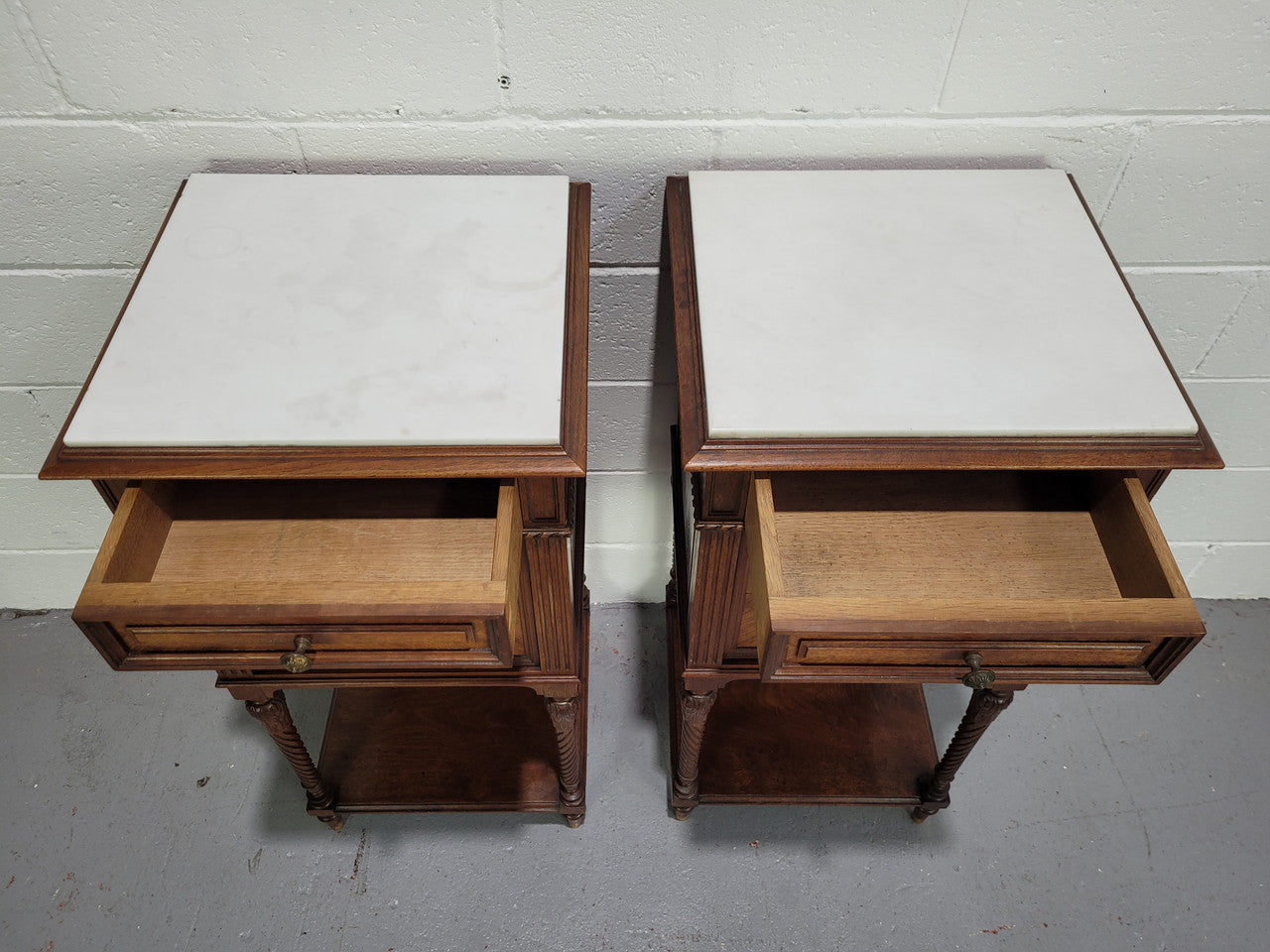 Pair parquetry Walnut bedside cabinets with white inset marble tops. In good original detailed condition.