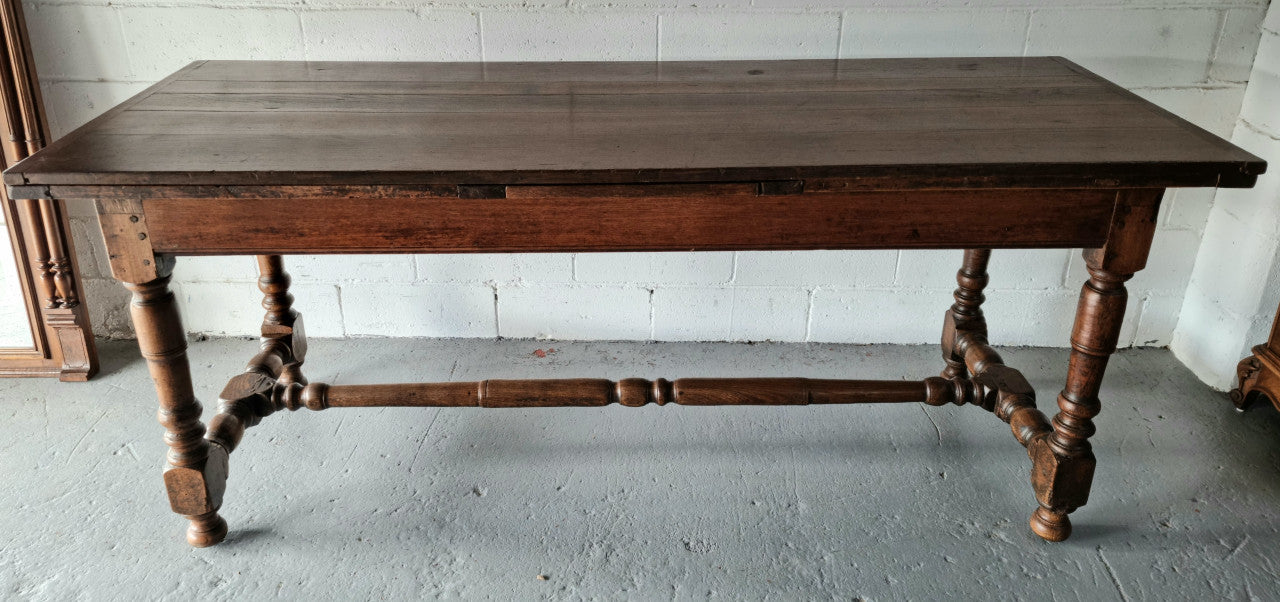 Appealing and rare French Oak Farmhouse extension table. Charming character to the top and comfortably seats 12 people. In good original detailed condition.