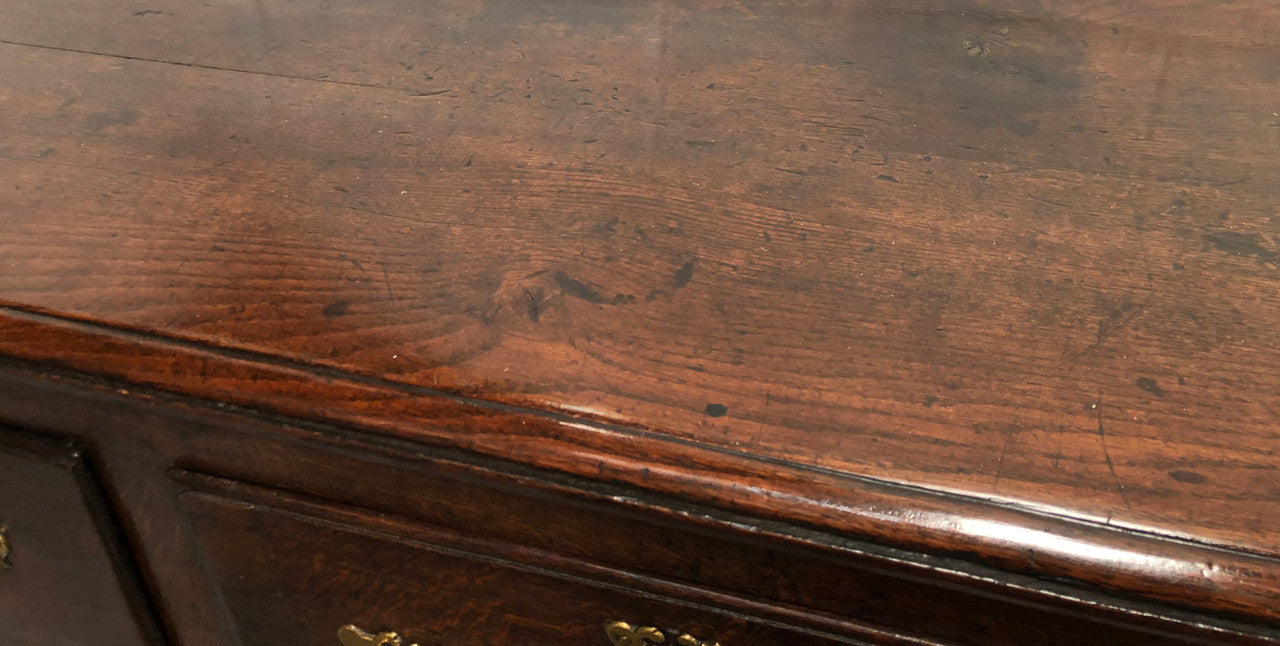 Early 19th Century English Oak dresser base with three large drawers. In very good original detailed condition.