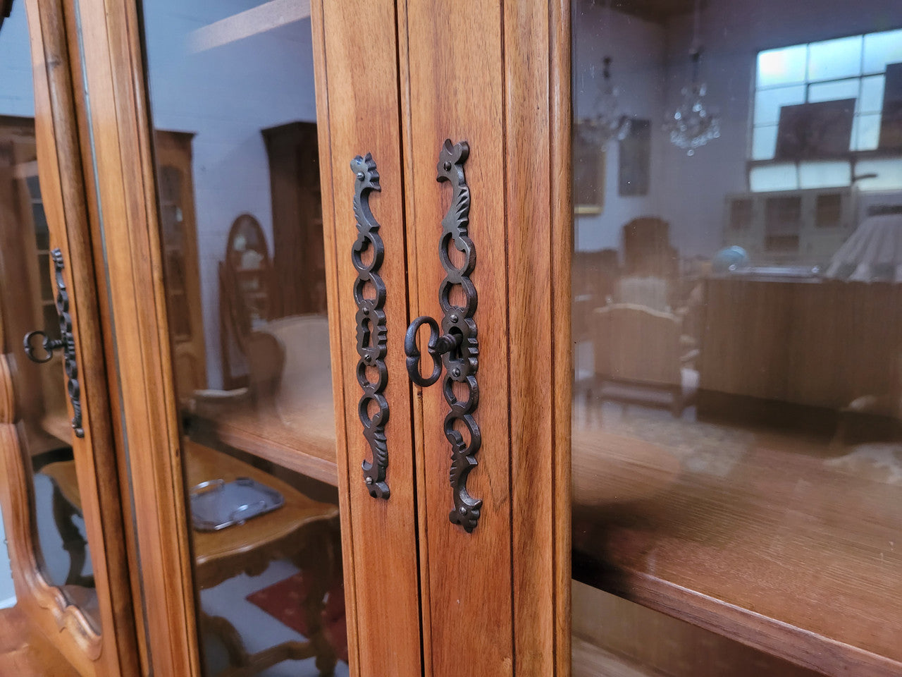 Magnificent French Walnut two-body four door display cabinet. Heaps of storage space with four glass doors at the top with shelves and four solid doors below also with shelving. It has been sourced from France and comes with a key for each door and all are lockable. In good original detailed condition.