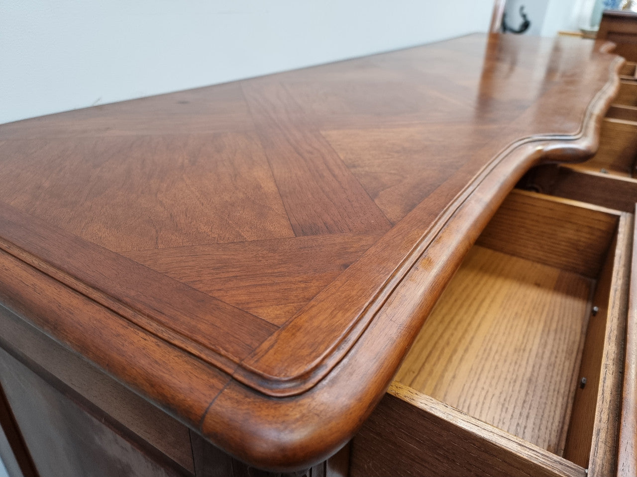 French parquetry top Cherry Wood four-door and four-drawer sideboard. Very decorative carving and is in good original condition.