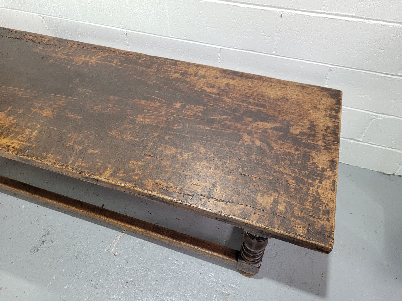 Hard to find longer then usual lovely rustic oak coffee table on turned legs. In good original detailed condition.