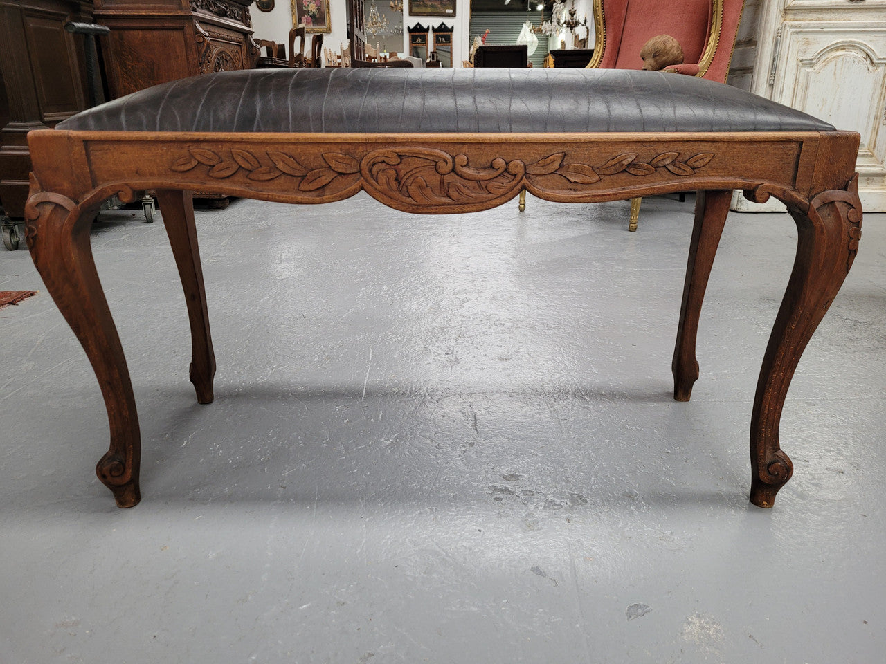 French Oak newly upholstered leather look duet stool. In good original detailed condition and new upholstery.