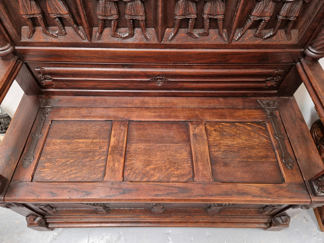 Early 19th Century French Oak Gothic style hall seat with a lift up seat. It has amazing detailed carvings and is in good original detailed condition.