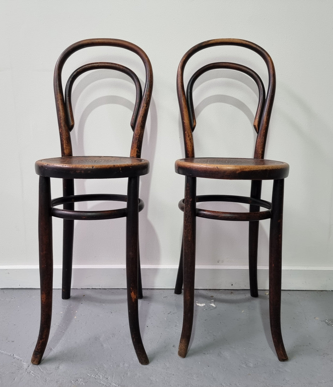 Rare petite cafe Bentwood chairs with original shell embossed seats. They are in very good original condition. They would make great addition to your breakfast bar.