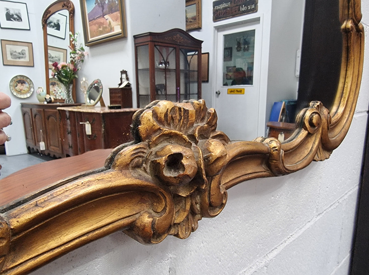 French Louis XV style wood carved and gilded mirror. Mirror is original and showing signs of age. It has been sourced from France and in good original condition.