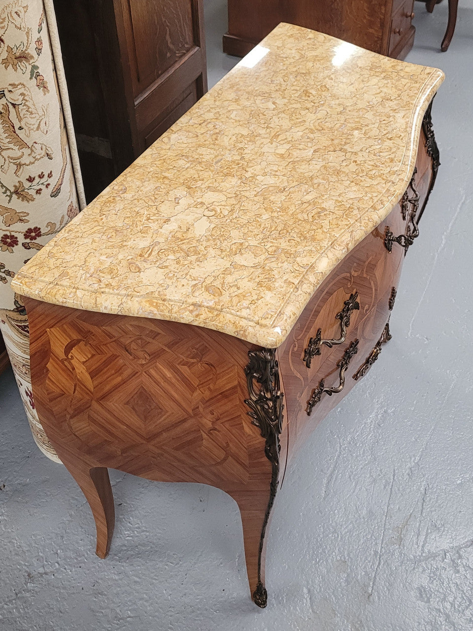 An elegant French Louis XV style kingwood two drawer commode with beautiful decorative inlay and ormolu mounts. Stunning coloured marble top and is in good original detailed condition.
