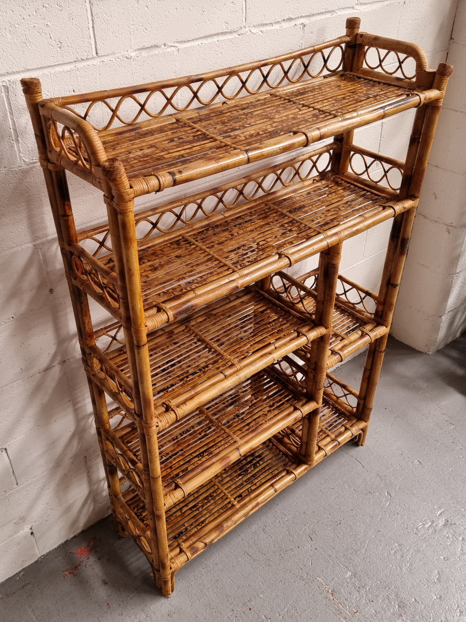 Vintage Tortoiseshell Bamboo Shelves. Good size unit with irregular shelves. It is in good original condition and it very solid.