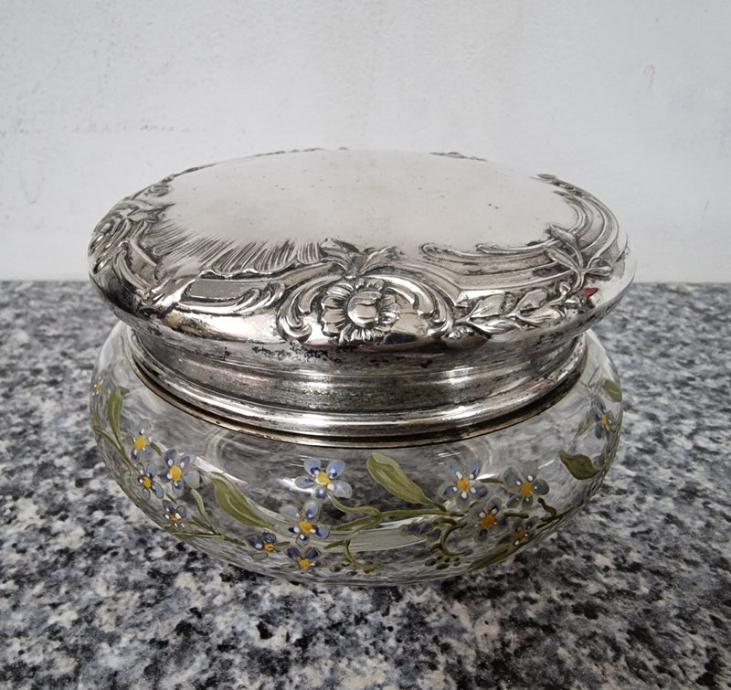 Silver lidded dressing table powder/trinket bowl with beautifully hand-painted floral enamel. In good condition please view photos as they help form part of the description.