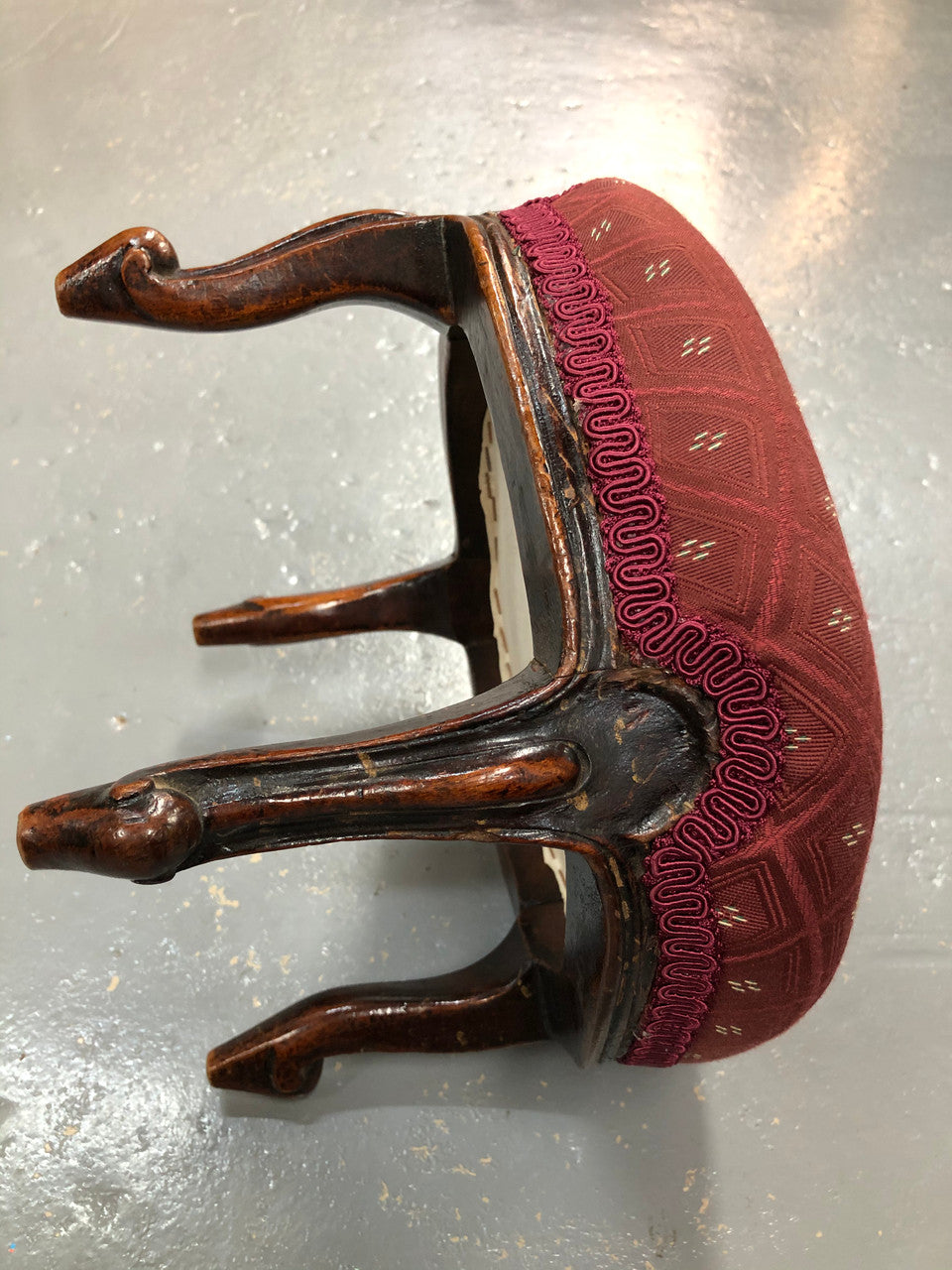 Upholstered Antique Mahogany round foot stool with beautiful carved feet. In very good original condition.