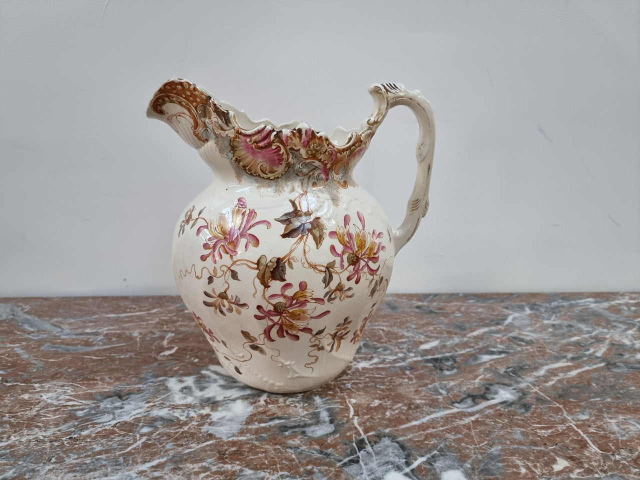 Delightful late Victorian floral English ceramic Jug and Basin set. Marked on base B&T. In good condition please view photos as they help form part of the description.