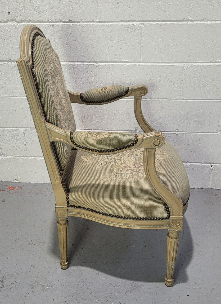 Lovely Louis XVI style painted fauteuil with lovely sage coloured tapestry upholstery. In good original condition.