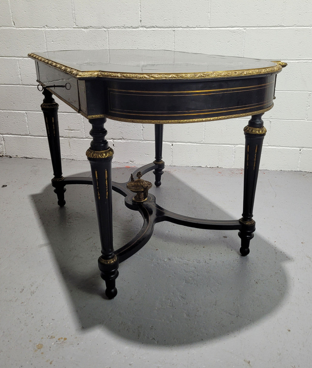 19th Century Napoleon III boulle ebonized centre table. Beautiful decorative mounts and has a drawer on one side. In good restored condition.