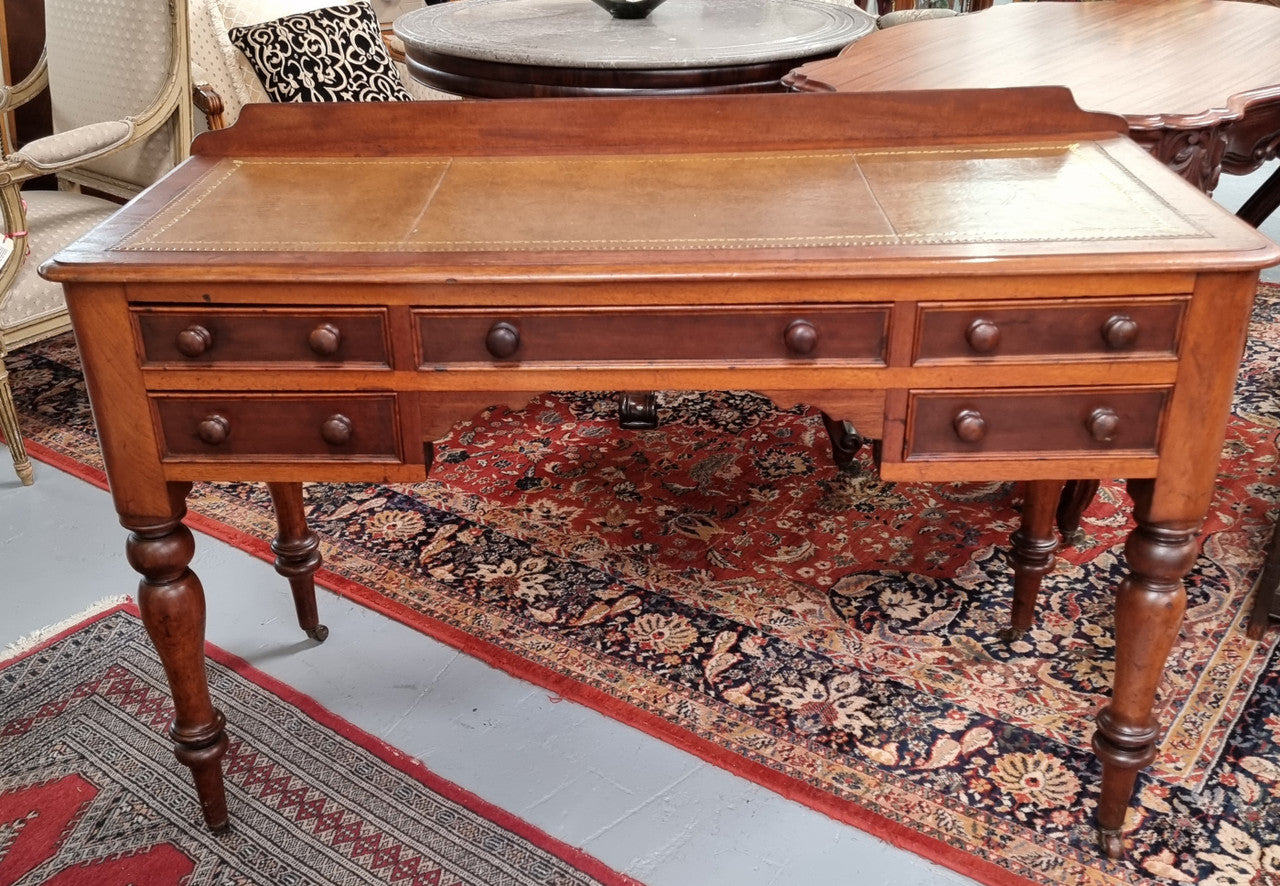 Lovely Victorian Cedar leather tooled top desk, with five drawers on castors and of pleasing proportions. In very good original detailed condition and has been sourced locally.