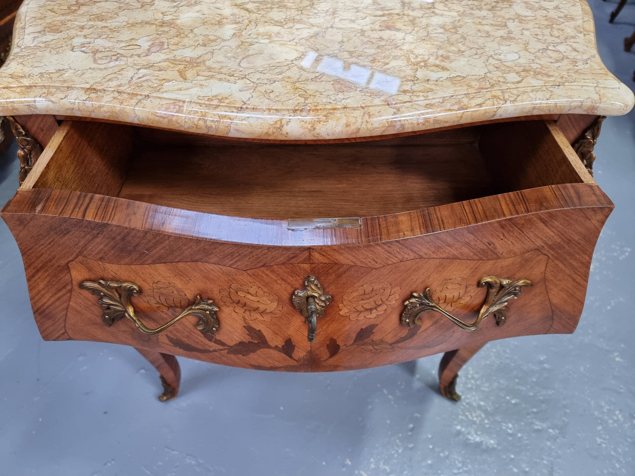 Fabulous French petite inlaid two drawer commode with ormolu mounts and lovely marble top. It is in good original detailed condition.