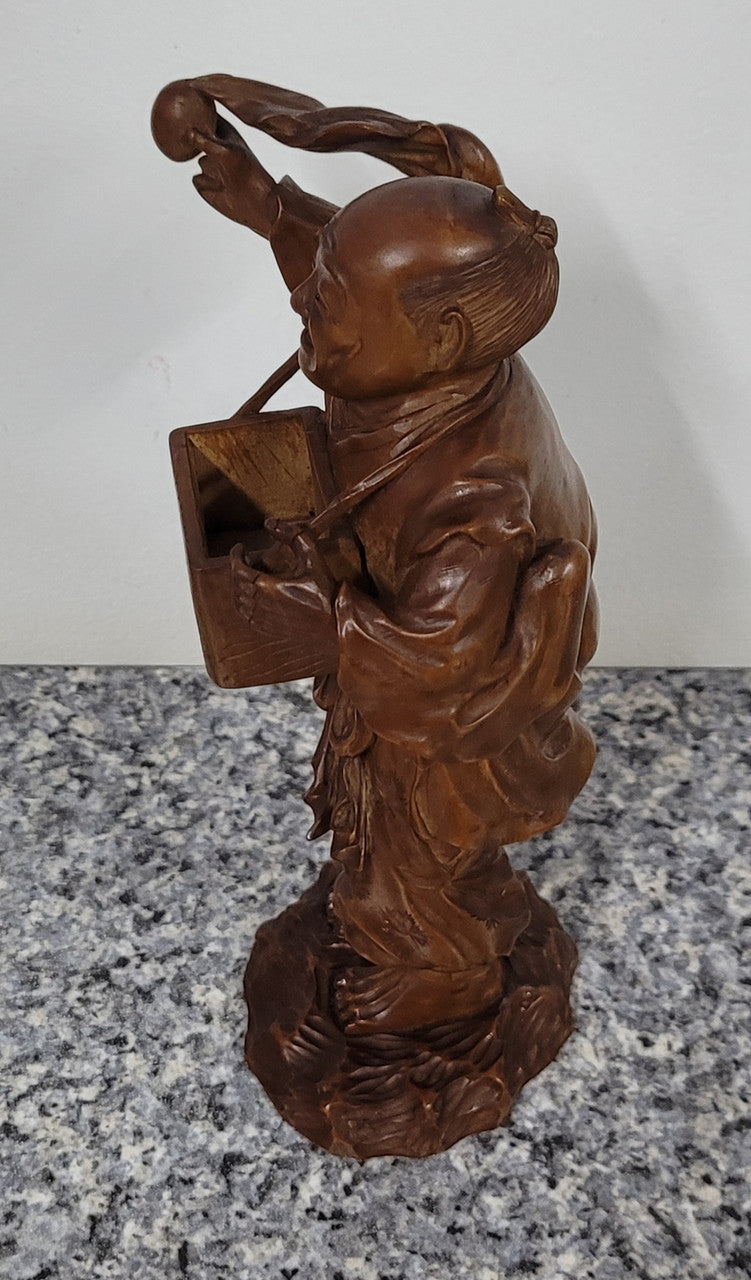 Exceptional Japanese Meiji period boxwood carving of a Peach Seller. Circa 1880's and it is signed to base. It is in good original condition, please view photos as they help form part of the description.
