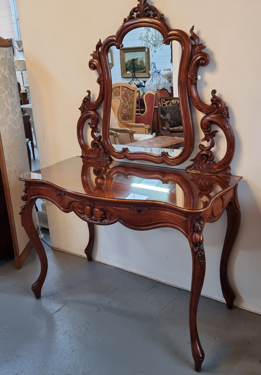 Walnut Parisian late 19th Century dressing table with mirror. Also has a glass top for protection, mirror moves and has drawers with key and working locks. In good original detailed condition.