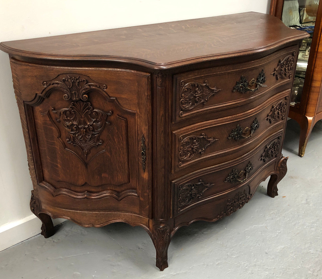 French Louis XV style dark Oak carved, two door and three drawer Commode /side cabinet. Could also be used as a TV cabinet or in the bedroom as storage very versatile. In good original detailed condition.