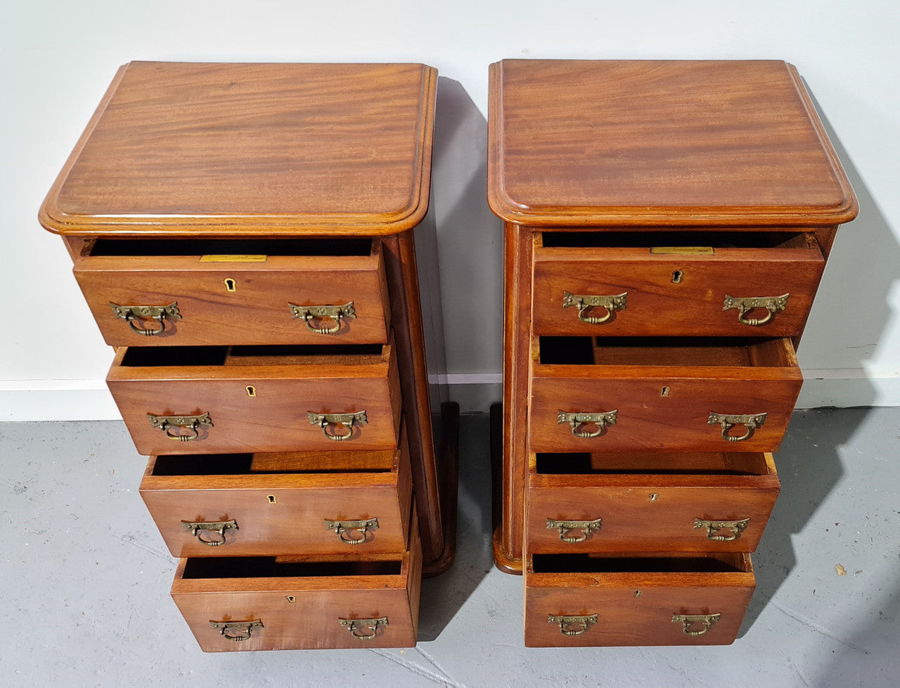 Pair of English Victorian Mahogany bedside drawers. In good original detailed condition.
