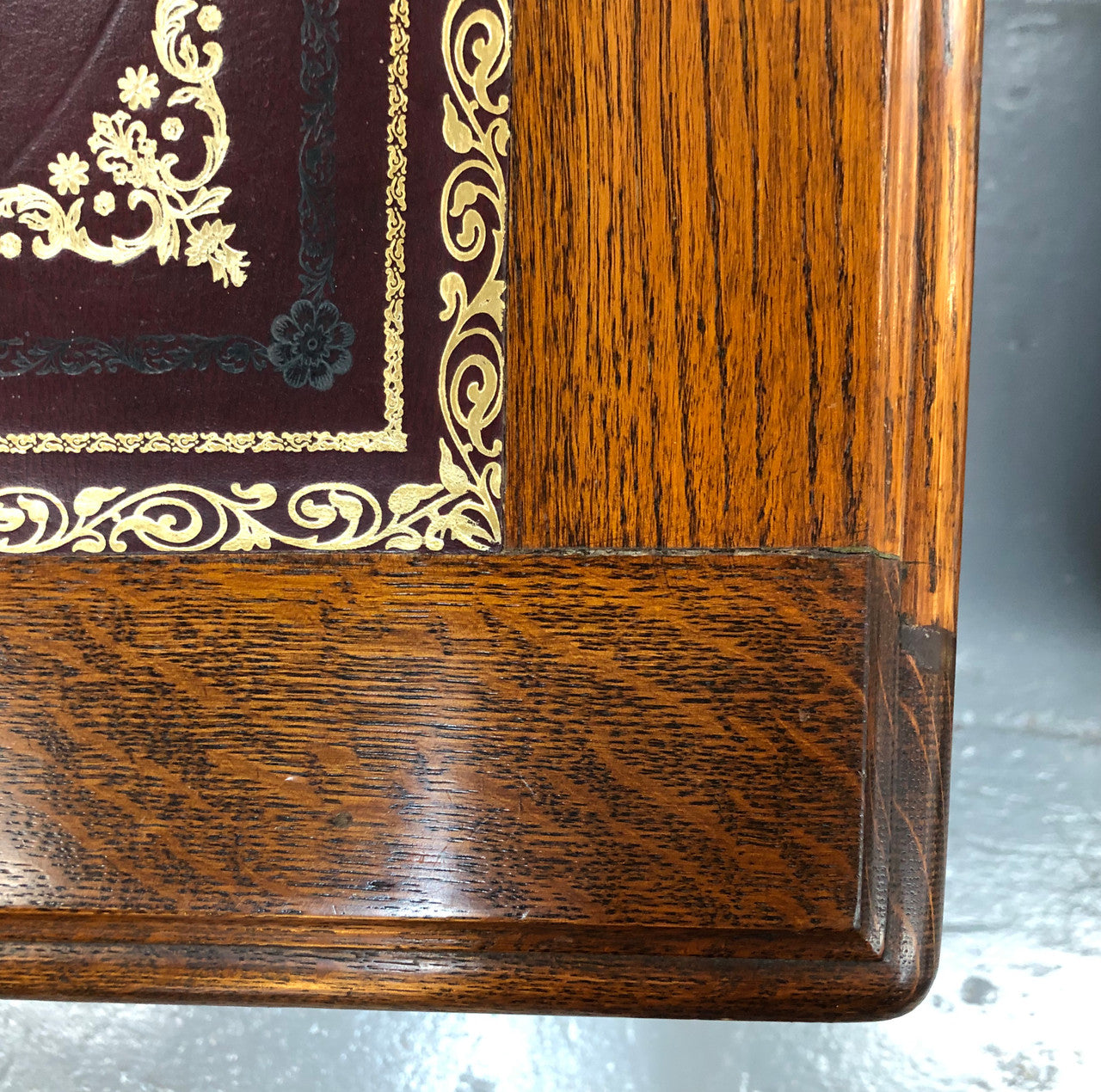 Lovely large English oak partners desk, with a beautiful burgundy tooled leather top. Plenty of storage space, both sides have 9 functioning drawers. It is in very good condition.